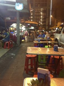 Street food vendors in Bangkok's Ari neighborhood prepare to close up as the last customers of the night head home.
